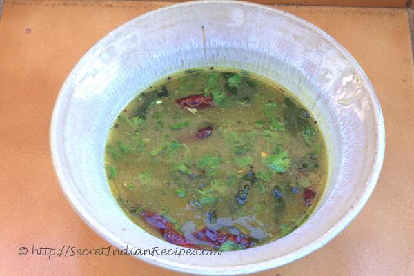 photo of maanga rasam (mango peppered soup)