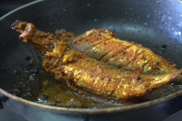 photo of fish being fried